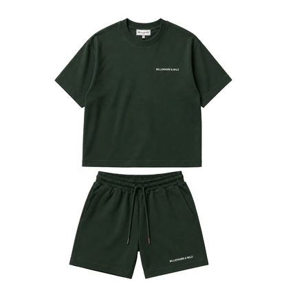 A dark green two-piece lounge set , featuring a short-sleeve crewneck t-shirt and matching drawstring shorts, laid flat on a light beige background.